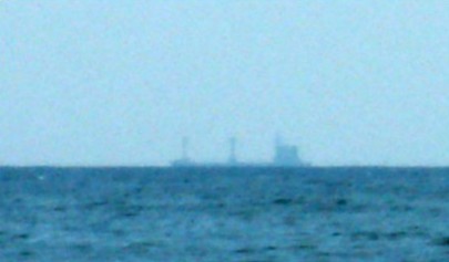 Ships sinking behind the horizon